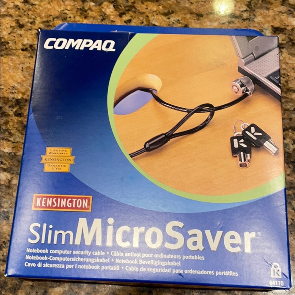 Compaq Kensington computer cable with key lock.